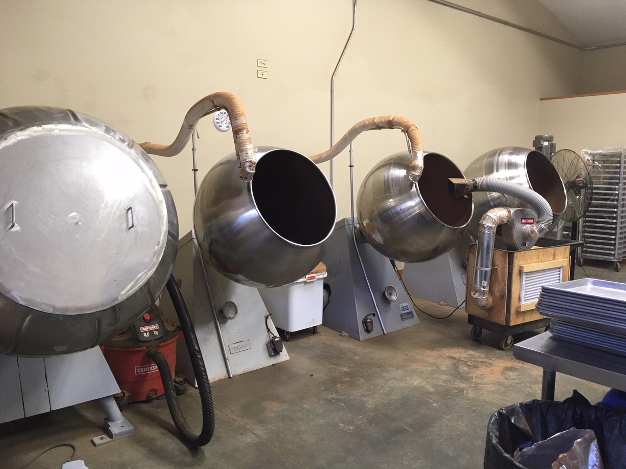 Chocolate panning machines turning product to Tierra Farm’s specifications